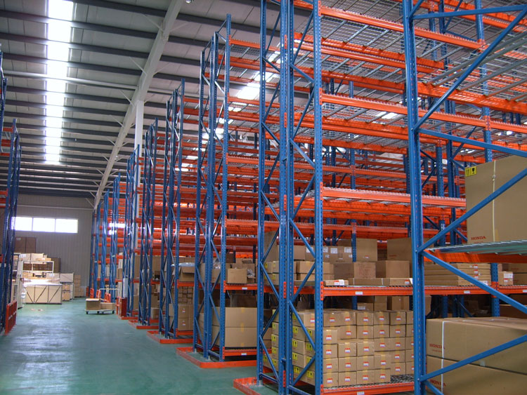 Why do industrial storage racks need regular inspections?